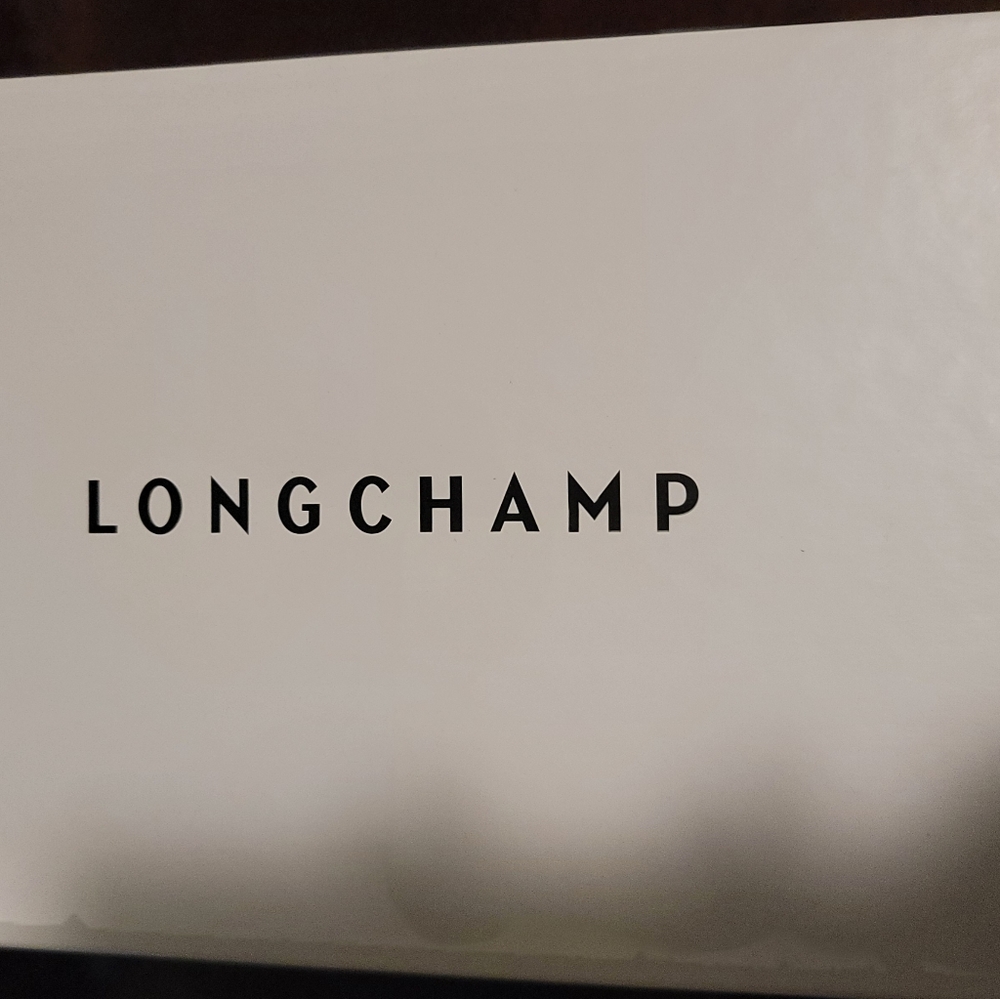 Longchamp black leather loafers.